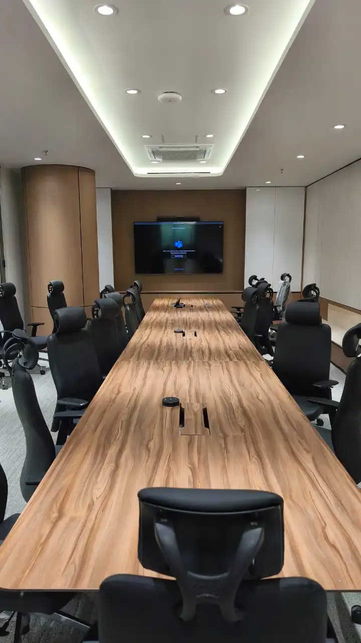 Large customer meeting room equipped for hybrid group sessions