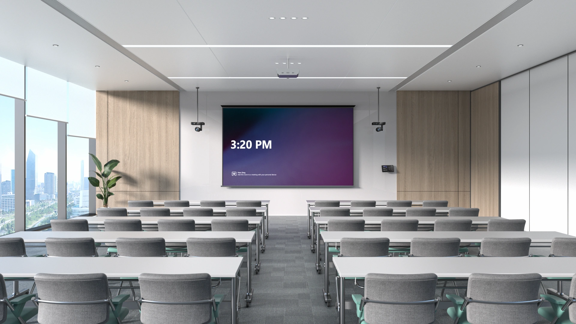 Training room with rows of desks facing a large screen