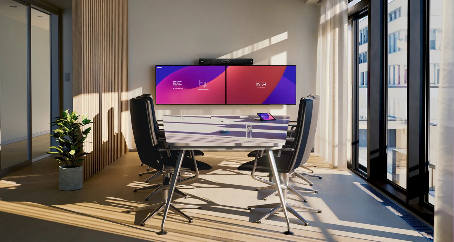 Medium meeting room with Cisco Room Bar Pro spanning two wall displays